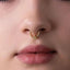 A close-up of a person's face, focusing on their nose and lips.