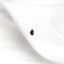 a pair of black earrings sitting on top of a white cloth