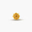 A single, golden rose-shaped object is centered against a plain white background.