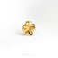 a gold plated metal flower on a white background