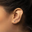 a close up of a person's ear with a star on it