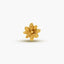 A single, intricately designed gold flower-shaped object is the central focus of the image.
