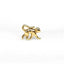 a close up of a white shirt with a gold bow on it