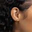 a close up of a person wearing a pair of ear piercings