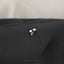 a close up of a pair of earrings on a black cloth