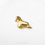 A small golden figurine of a seal is shown against a white background.