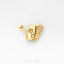 A small gold-colored watering can with a flower design on it, placed on a white background.