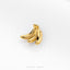 A single gold-colored banana-shaped earring is shown against a white background.