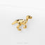 A small gold-colored figurine of a dinosaur or prehistoric creature is shown against a white background.