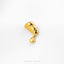 A gold-colored pin or brooch in the shape of a female head, possibly resembling a queen or regal figure, is displayed against a white background.