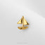 A small gold-colored ship pendant is shown against a white background.
