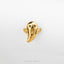 A gold-colored ghost-shaped pin or brooch is shown against a white background.