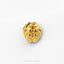 A single, shiny gold-colored object, possibly a piece of jewelry, is centered against a white background.