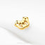 A gold-colored metal object with a unique, abstract design is shown against a white background.