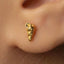 A close-up of a person's ear with a small gold earring in the earlobe.