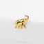 A small gold elephant figurine is displayed against a white background.