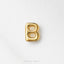 A single, shiny gold letter 'B' is centered against a white background.
