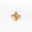 A gold-colored metal piece with a unique, intricate design, resembling a knot or a geometric pattern, is shown against a white background.