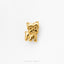 A small, shiny gold-colored dog figurine is displayed against a white background.