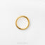 A single gold ring is displayed against a white background.