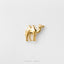 A small gold camel figurine is displayed against a white background.