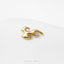 A gold-colored flame-shaped earring is shown against a white background.