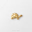 A small, shiny gold-colored turtle figurine is displayed against a white background.