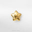 A single, shiny gold star-shaped charm with a smiley face on it.