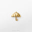 A small gold-colored umbrella charm is displayed against a white background.