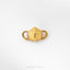 A gold-colored metal object resembling a mask or face covering is shown against a white background.