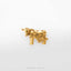 A small golden cow figurine is displayed against a white background.