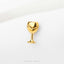 A small gold-colored wine glass-shaped pin or brooch is displayed against a white background.