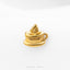 A gold-colored cup with a handle and saucer, placed on a white background.