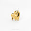 A small golden dog figurine is shown against a white background.