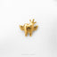 A small golden tooth-shaped charm with wings and a crown is displayed against a white background.