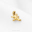 A small gold-colored earring in the shape of a fish is shown against a white background.