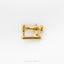 A gold-colored sewing machine pin is shown against a white background.