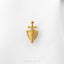 A gold-colored metal shield-shaped badge with a cross on top, placed on a white background.