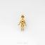 A small golden figurine is shown against a white background.
