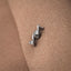 A silver necklace clasp is attached to a textured fabric surface.