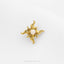 A gold-colored pendant with a sun-shaped design and a small opal stone in the center.