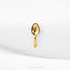 A single gold spoon is shown against a white background.