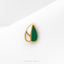 A single, ornate earring with a green and white color scheme, resting on a white surface.