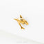 A small gold shark figurine is shown against a white background.