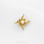 A gold-colored pendant with a sun-shaped design and a small opal stone in the center.