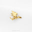 A small golden dragon pin is shown against a white background.