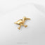 A small gold bird figurine is displayed against a white background.