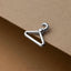 A silver metal hanger clip is attached to a piece of paper.