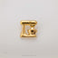 A gold-colored metal object resembling a mixer or blender is shown against a white background.