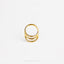 A gold ring with three concentric circles is shown against a white background.